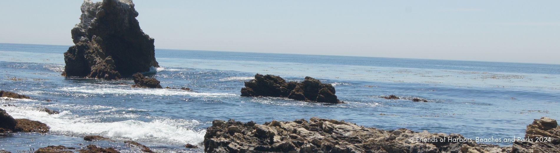 Rocky Beach View of Little Corona with waves gently caressing the tide pools.